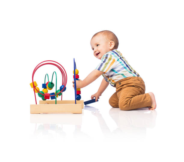 istock Happy baby boy playing with toy 1075739606