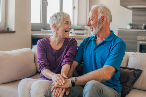 istock Smiling couple holding hands 1075739668
