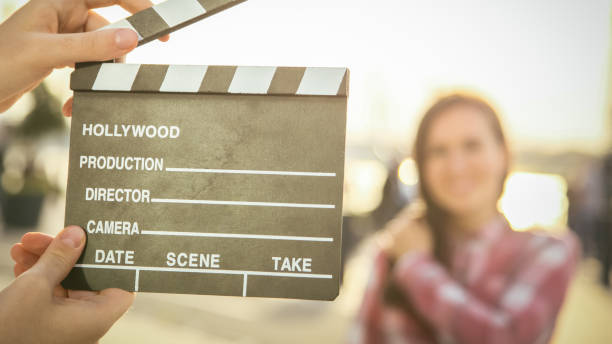 istock Man hands holding movie clapper 1075742474