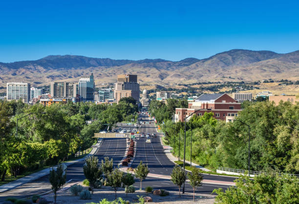 Downtown Boise Idaho Downtown Boise viewed down Capitol Blvd from the 1925 train station with foothills in background foothills photos stock pictures, royalty-free photos & images