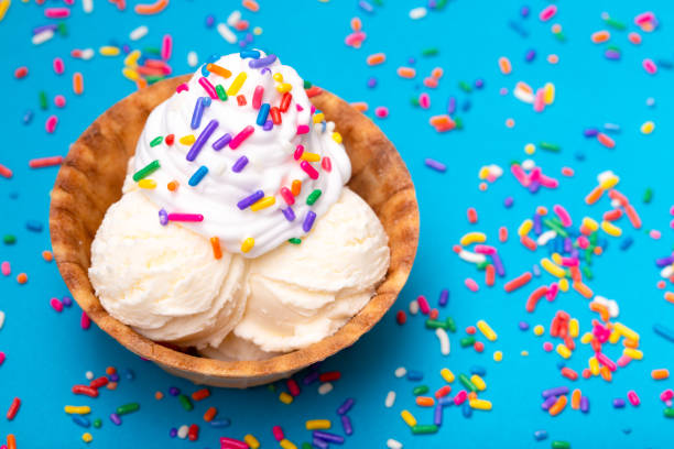 Vanilla Ice Cream in a Waffle Cone Bowl on a Blue Background