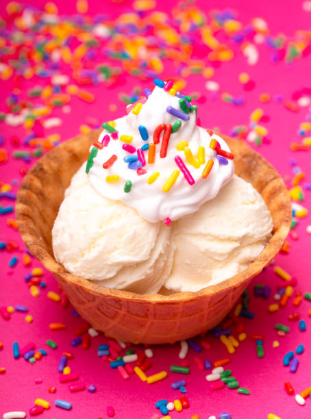 istock Vanilla Ice Cream in a Waffle Cone Bowl on a Pink Background 1075751134