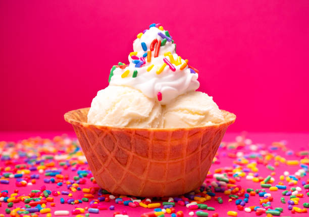 istock Vanilla Ice Cream in a Waffle Cone Bowl on a Pink Background 1075752284