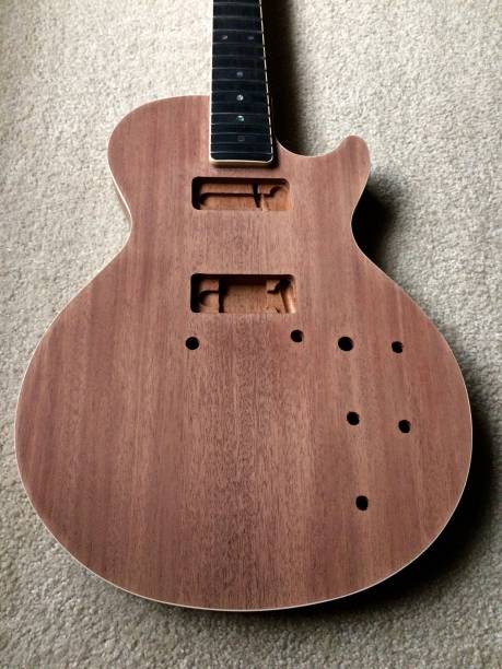 istock Electric guitar body with no strings,pickups.controls or finish 1075756562