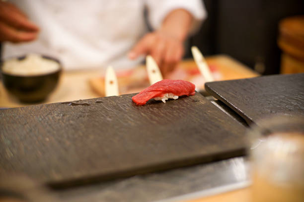istock Professional chef preparing sushi at a Japanese restaurant 1075764262