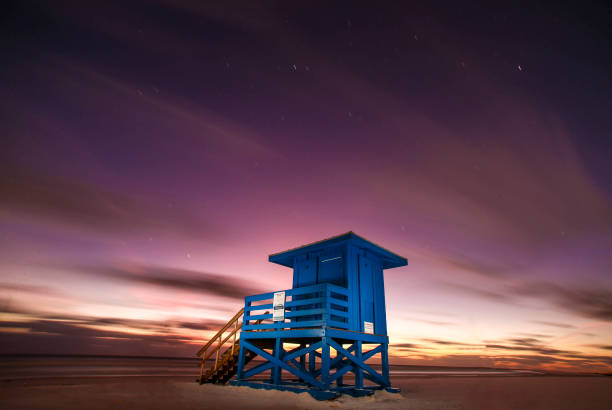 Lifeguard Stand On The White Sand At Siesta Key Beach As A Beautiful Sunset Takes Place
