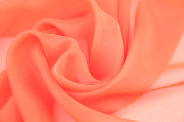 istock Texture chiffon fabric orange  color for backgrounds 1075772208