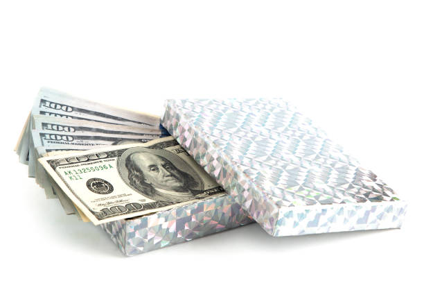 A Stack of American Hundred Dollar Bills as a Gift A Stack of American Hundred Dollar Bills as a Gift gift lounge stock pictures, royalty-free photos & images