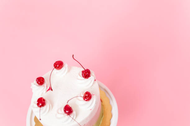 istock Birthday Spumoni cake on pink background. 1075794942
