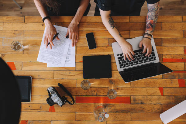 istock Overhead image of a young design team working in a small startup office in Berlin 1075809310