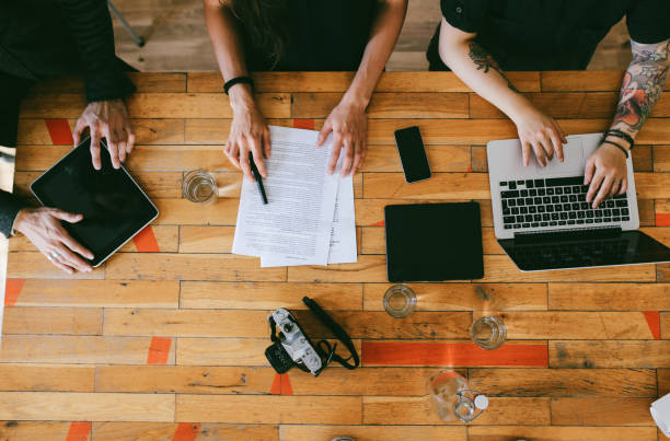 istock Overhead image of a young design team working in a small startup office in Berlin 1075809820