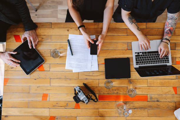 istock Overhead image of a young design team working in a small startup office in Berlin 1075812586