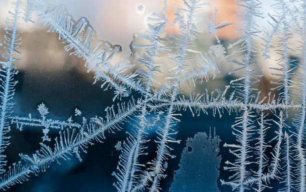 istock beautiful frosty patterns on glass 1075844998