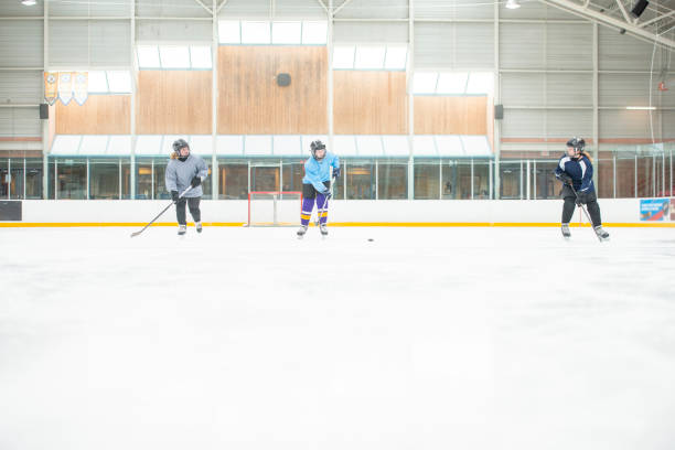 istock Mom And Daughters Playing Hockey 1075845140
