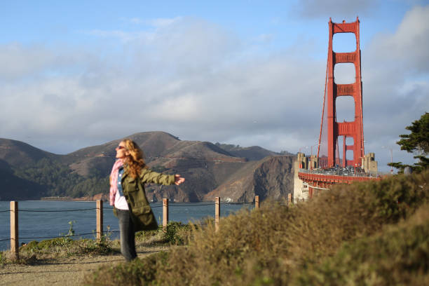 San Francisco different location pics with a mid-age women visiting and having fun in tourist place.