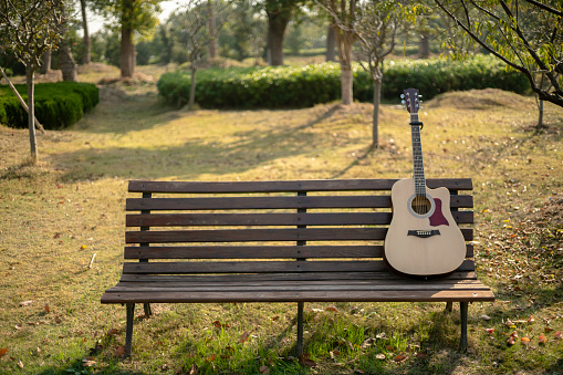 guitar on park bench
