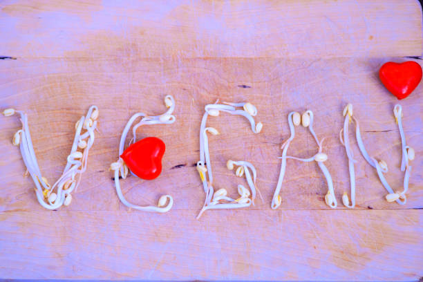 istock Vegan word written with soy on a bright background 1075851984