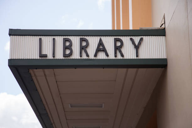 Outside of a library showing the sign on the building.