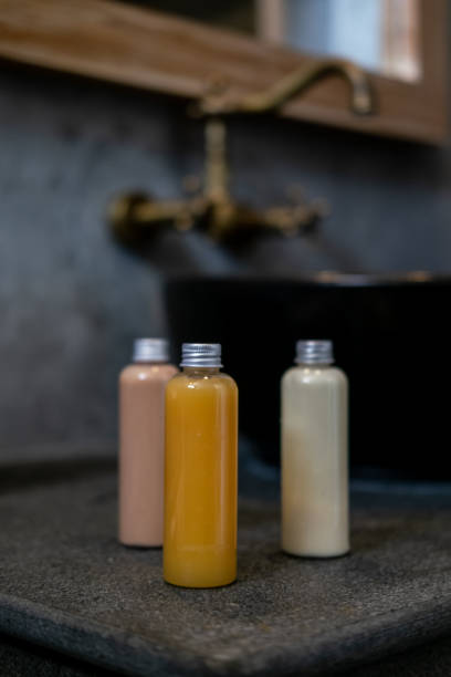 istock Spa cosmetics in bottles on dark gray  table 1075857486