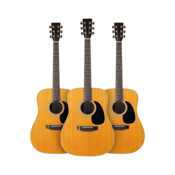 istock Musical instrument - Front view three classic vintage acoustic guitar. Isolated 1075866666