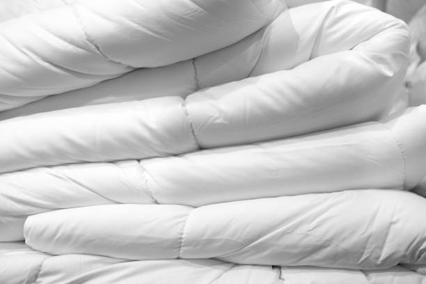 New mattress sheets, comforter and pillows New mattress sheets, comforter and pillows duvet stock pictures, royalty-free photos & images