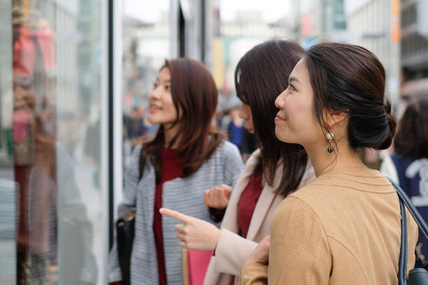 istock Women looking at show window 1075873592