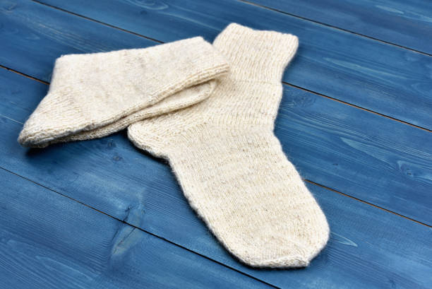 istock Wool socks on a wooden desk 1075884482