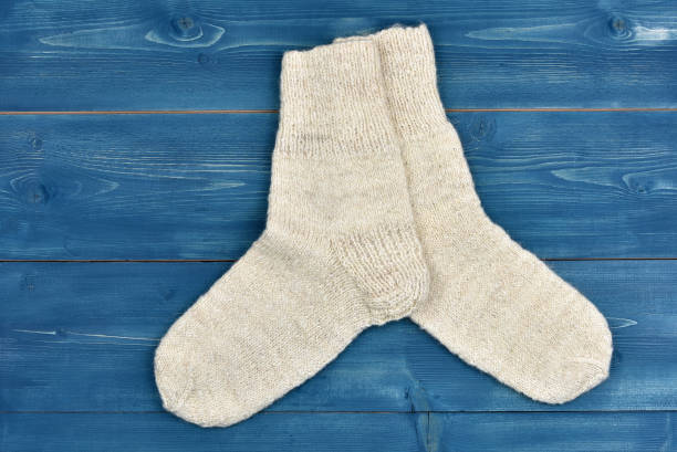 istock Wool socks on a wooden desk 1075884536