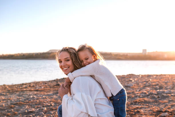 istock Mum and daughter having fun together outdoors. 1075890796