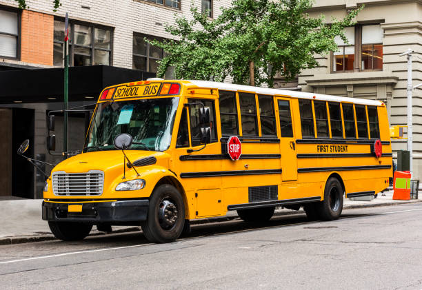 American schoolbus parked in the street. Vintage look and blurred edges.