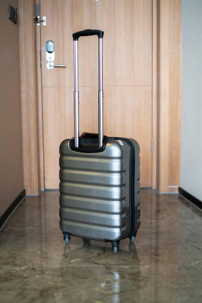istock luggage in doorway 1075915546