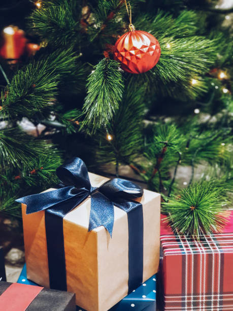 istock Christmas tree decorated with beautiful ornaments and gift box 1075915784