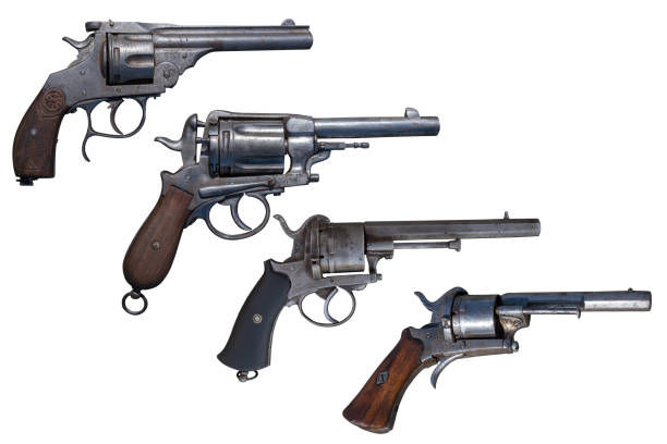 istock Ancient weapon. Four old revolvers isolated. 1075923902