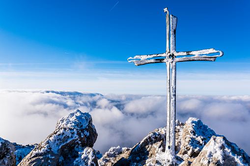 Frosted cross on a mountain peak Velky Rozsutec in Mala Fatra in Slovakia. The peak is situated in the north part of Mala Fatra (Little Fatra) called Krivanska Mala Fatra.