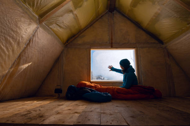 traveler, woman rests in the old mountain hut - home interior cabin shack european alps imagens e fotografias de stock