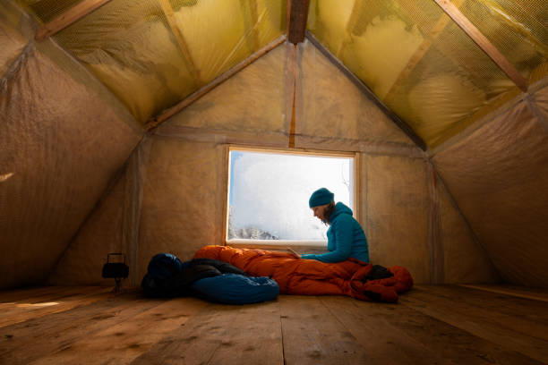 traveler, woman rests in the old mountain hut - home interior cabin shack european alps imagens e fotografias de stock