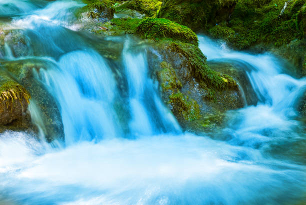 closeup creek rushing among a stones