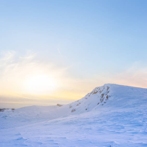 istock hill among a winter snowbound plains at the sunset 1075944926