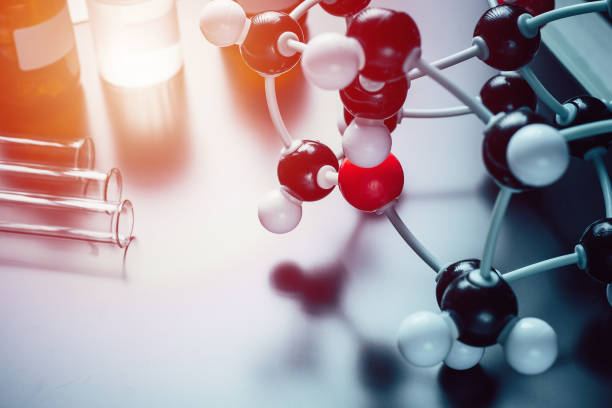 istock molecular formula and laboratory equipment on a blue background with copy space. Science organic chemistry concept 1075951370