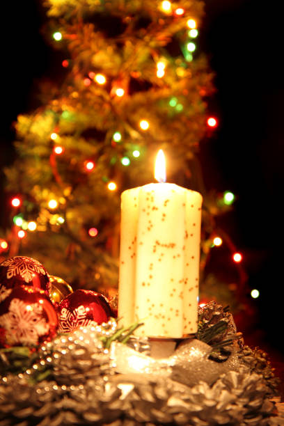 istock christmas tree and the candle 1075951824