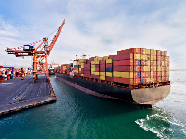 Aerial view of cargo ship in transit. Aerial view of cargo ship in transit. maritime container stock pictures, royalty-free photos & images