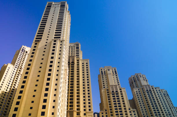 istock Skyscrapers from below in Dubai against blue sky. 1075964652