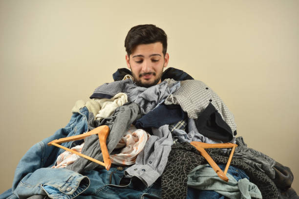 istock Young men cant decide what to wear 1075965098
