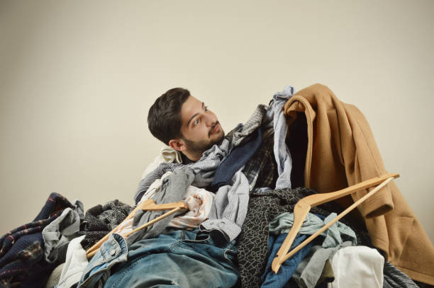 istock Young men cant decide what to wear 1075969528