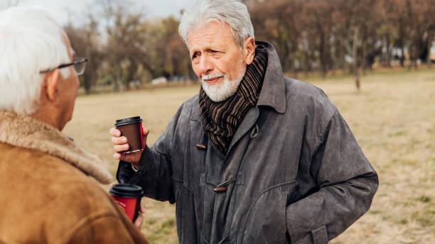 istock Older man talking to friend 1075970056