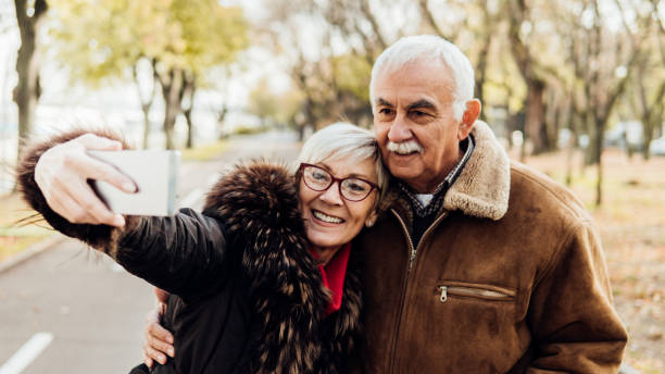 istock Husband and wife taking a selfie 1075970400