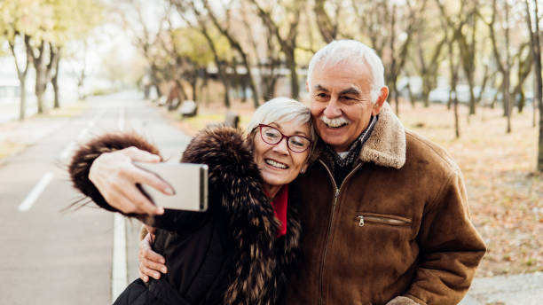 istock Happy people taking a photograph 1075970570