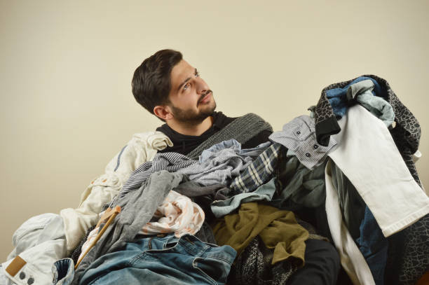 istock Young men cant decide what to wear 1075970998