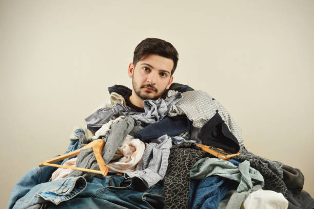 istock Young men cant decide what to wear 1075972674