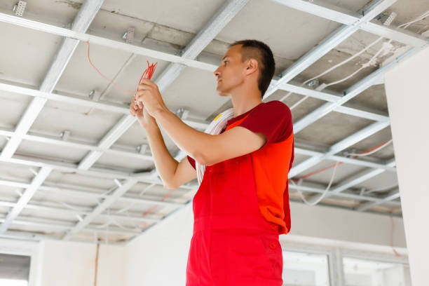 istock Man repairing electrical wiring on the ceiling 1075973206